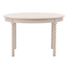 a white table with three wooden legs