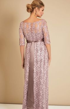 Made from beautiful vintage-inspired sheer lace, the Asha in Lilac is a stunning floor-length gown. From Baby Shower to Bridesmaid, with a stylish boat neckline, sheer ¾ length sleeves and dramatic full skirt that drapes over your bump, you’ll look and feel amazing at the most special of occasions. •Premium embroidered tulle in lilac •Floor length gown with ¾ sleeves •Empire waist with gentle gather over the bump •Sheer neckline and sleeves •Fully lined with premium jersey •Add a sash to define Lace Mother Of The Bride Dress With 3/4 Sleeves, Mother Of The Bride Dress With Illusion Neckline, Mother Of The Bride Dress With Lace Bodice, Floor-length Mother Of The Bride Dress With Lace Sleeves, Fitted Lace Dress For Wedding With 3/4 Sleeves, Mother Of The Bride Evening Dress With Lace Sleeves, Fitted 3/4 Sleeve Lace Dress For Wedding, Fitted Lace Dress With 3/4 Sleeves For Weddings, Fitted 3/4 Sleeve Lace Wedding Dress