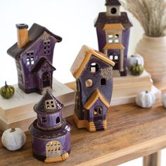 Ceramic Halloween Village decorations on wooden table. Halloween Ceramics Ideas, Halloween Houses, Ceramic Halloween, Spooky Decorations, Creepy Crawlers, Casa Halloween, Farmhouse Halloween, Clay Houses, Tealight Candles