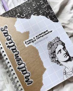 a notebook with an image of a woman's face on it