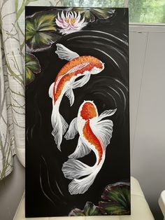 a painting of two koi fish swimming in a pond