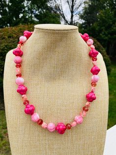 The necklace is 19 inches with 3-inches Carnation pink satin melons vintage glass beads Cinnamon knot beads are acrylic Peanut baby pink acrylic beads Crystal pink beads Mother of Pearl Shell and Resin Beads Pink Beads 10mm Baby Pink Acrylics, Large Bead Necklace, Beaded Fashion, Multicolor Bracelet, Carnation Pink, Pink Acrylic, Pink Acrylics, Glass Bracelet, Resin Beads