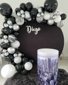 a black and white photo frame with balloons around it that says digo on the front