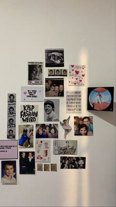 a white wall with many different pictures and magnets attached to it's sides