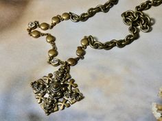 This beautiful brass and crystal vintage chain is rare and unique. The pendant is a bronze Jerusalem Cross, also known as a five-fold cross. A beautiful unique gift. ITEM ∙ S P E C I F I C A T I O N S: - PENDANT: 7/8" x 7/8" bronze charm - CHAIN LENGTH: 18" vintage brass chain, 4 3/4" section of unique vintage chain C A R E ∙ T I P S: We don’t want your special moment to fade. To maintain the quality of your jewelry, please: - Do not wear it to the pool, spa, or the beach - Remove when sleeping, Bronze Cross Bohemian Necklace, Bronze Bohemian Cross Necklace, Bohemian Bronze Cross Necklace, Antique Brass Cross Pendant Necklace, Vintage Brass Cross Jewelry, Vintage Brass Cross Pendant Necklace, Vintage Brass Cross Pendant Jewelry, Antique Bronze Cross Necklace, Bronze Brass Cross Necklace