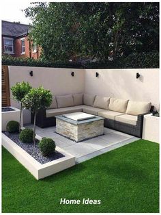 an outdoor living area with grass and plants