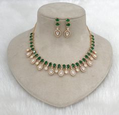 Very Gorgeous and elegant Lab Kundan  Polki stone Necklace Earrings Set  In Gild  with matching earrings  Versatile. Can be paired with number of outfits. Perfect to wear at weddings occasions. Highest quality and craftsmanshi earrings have pushback  Necklace has adjustable chain This set will surely make heads turn .. Finest Kundan work . Customized orders takes 3 to 4 weeks, depending on piece requirements. The Ombre Designs Jewelry pieces can be customized in accordance with your requirement. Please Email or Whats app on : +91 8448833193 / sonalikamehra@ theombredesigns.com Diwali Reception Kundan Necklace With American Diamonds, Hand Set Kundan Necklace For Reception & Diwali, Kundan Necklace With American Diamond For Reception, Festive Jeweled Kundan Necklace For Reception, Kundan Temple Necklace With Stone Setting For Wedding, Wedding Kundan Necklace With Stones, Festive Kundan Necklace With American Diamonds For Celebration, Traditional Kundan Necklace With Stones, Festive Celebration Kundan Necklace With American Diamonds