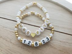 "This adorable bracelet set is perfect for a bride to be! The price is for both bracelets, but they can also be purchased separately if you only want one.  One bracelet says \"Mrs.\" and the bride's new last name. This bracelet is made with a gold 18k gold plated heart bead separating the Mrs. and the last name, white glass 4mm round beads, and 24k gold plated bumpy rondelle accent beads. It also has a gold plated round bead to cover the knot. The letters used are round white acrylic with gold l Bride Clay Bead Bracelet, Bracelet Team Bride, Adjustable White Bracelet For Anniversary, Personalized White Charm Bracelet For Anniversary, White Charm Bracelet For Anniversary On Mother's Day, White Letter Beads Name Bracelet For Wedding, Customizable White Bracelets For Anniversary, Personalized White Name Bracelet For Wedding, Customizable White Name Bracelet For Anniversary