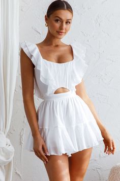 White romper Lined Ruffle trim detail Open back with string ties Zipper in back of shorts Make an entrance in our pretty Always My Girl romper. Perfect for Summer day pool parties teamed with wedges and a tote. We are obsessed with that open back with string-tie detail. You're sure to get noticed in this one! MODEL INFO Model is wearing size XS Height: 5'9" Bust: 34" Waist: 25" Hips: 37" GARMENT INFO Flat garment measurements This was manually measured from the actual garment Sizing may vary by Yellow Bridesmaid Dresses, Yellow Bridesmaids, Red Bridesmaids, Pool Parties, White Romper, Lace Bodycon Dress, Iron Material, Blue Bridesmaids, Date Night Dresses