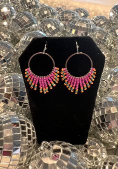 These delicate hoops are handwoven with 3 vibrant colors of pink, blue, orange. They are made to order so please allow an extra 1-3 days for me to complete them. Beads: Handwoven with the highest quality Miyuki Delica beads. These cylindrical glass beads are precisely engineered to ensure the highest degree of consistency in size and shape. Dimensions: Earrings hang about 2" below earlobe and are approximately 1" wide. Packaging: All earrings are individually packaged & come with silicone earring backs. Boho Jewelry Earrings, Miyuki Delica Beads, Earrings Beaded, Delica Beads, Scottsdale Az, Earring Backs, Boho Jewelry, Blue Orange, Beaded Earrings