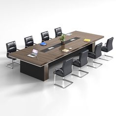 an office table with chairs around it and a laptop on the desk next to it