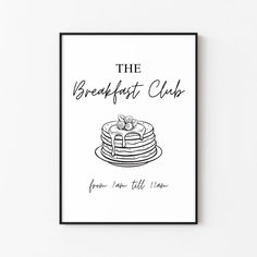 the breakfast club poster with pancakes and fruit on top, against a white wall background