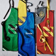 four aprons with different colors and designs on them