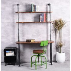 a desk and chair in front of a bookshelf