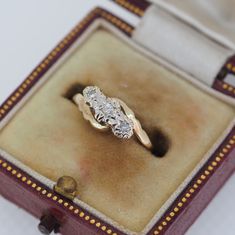 an antique diamond ring in a velvet box