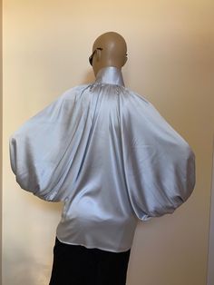 "This is a very stylish Womens Silk blouse. It is comfortable and cozy. Made for a free flowing fit. Great for all year around and for any special occasion or casual day can be dressed up or dressed down. SIZE CHART SIZE S - US 6, UK 8, EU 36 bust: bust around 34.5\"/90cm Waist: waist around 27.5\"/70cm Hips: hips around 34.5\"/90cm For more beautiful designs, please visit and my new shop: https://www.etsy.com/shop/JustMariyaFromBG?ref=seller-platform-mcnav" Elegant V-neck Party Shirt, Satin V-neck Top For Office, Solid Color Shirt For Spring Party, Elegant Blouse For Night Out, Fall Evening Tops With Blouson Sleeves, Satin Puff Sleeve Tops For Work, Silk Party Top With Puff Sleeves, Elegant Solid Color Padded Blouse, Satin Puff Sleeve Tops For Night Out