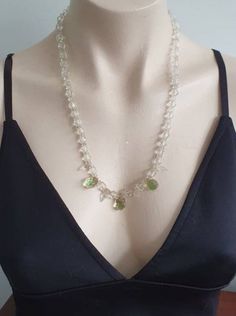 A beautiful crystal necklace from the Art Deco period with three beautiful teardrop crystal droppers in a green and pink. The necklace's beads are graduated getting smaller as they get to the back of the neck. It measures 59 cm and fastens with a secure brass screw clasp indicative of the 1920s/30s. Note: Being a vintage piece, any notable damage, missing parts or wear will be described as accurately as possible. However, minor imperfections & signs of wear should be expected. Please consider pi Green Elegant Dangle Crystal Necklaces, Green Drop Necklaces For Party, Green Drop Necklace For Party, Costume Jewelry Crystal Necklace With Faceted Beads, Green Crystal Beaded Necklaces As Gift, Green Crystal Beaded Necklace For Gift, Faceted Crystal Beaded Necklaces For Jewelry Making, Handmade Green Crystal Necklaces, Green Teardrop Faceted Necklace