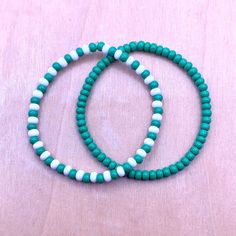 Ullabeads Green and White Bead Bracelet | Green Bead Bracelet Stack | Green Bead Anklet ⚠️NOTE: Please do NOT guess wrist size! Always measure your wrist :) ❤️ 🟢⚪️🟢⚪️🟢⚪️🟢⚪️ The color green is associated with luck peace, wealth, harmony, growth and nature. These stretchy green bracelets are great for any occasion and make a bold statement! Pair this set with your favorite outfit or footwear. Add these bracelets to your collection today! 🍀 📌OPTIONS A) Green Bracelet ONLY B) Green and White Bracelet ONLY C) Set of both  📌 Details: * 4mm Seed Beads * Elastic Stretch Cord ⬇️ WANT MORE SEED BEADS? STACK 'EM ⬇️ ✨ Ullabeads Red Bead Bracelet Set ✨ https://ullabeads.etsy.com/listing/1486854044  IMPORTANT -- PLEASE READ  ⭐️ NOTE: Ullabeads jewelry pictures are enlarged to show detail. These s Green Friendship Bracelet, White Bead Bracelet, Bead Bracelet Stack, White Beads Bracelet, Bead Anklet, Red Beaded Bracelet, Green Beaded Bracelets, Green Bracelet, White Bracelet