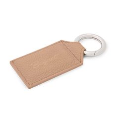 a tan leather keychain with a metal ring