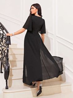 This casual butterfly sleeve wide leg jumpsuit with skirt is the perfect addition to your wardrobe! It comes in a beautiful black color and features a scoop neck, cap sleeves, and a regular slim fit. The high-quality fabric is slightly stretchy for extra comfort and has no sheer. Wear this jumpsuit with heels or sandals for a look that can take you from day to night. With its stylish design, it's sure to make you feel like the best version of yourself every time you wear it! Features: Color: Black Style: Casual Pattern Type: Plain Type: Tee Neckline: Scoop Neck Sleeve Length: Cap Sleeve Sleeve Type: Regular Sleeve Waist Line: Natural Fit Type: Slim Fit Fabric: Slight Stretch Sheer: No Size Chart (Inches): Product Measurements Size US Bust Hip Size Length Shoulder Sleeve Length Waist Size X Black Party Jumpsuits And Rompers, Black Short Sleeve Jumpsuit For Party, Black Maxi Length Jumpsuits For Party, Black Short Sleeve Jumpsuits And Rompers For Party, Black Maxi Length Jumpsuits And Rompers For Party, Black Cap Sleeve Dresses, Chic Black Cap Sleeve Dress, Elegant Black Maxi Dress With Cape Sleeves, Elegant Summer Maxi Dress With Butterfly Sleeves