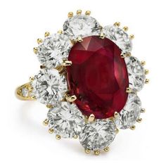 METAL SPECIFICATIONS Metal Name: Yellow Gold 14K STONE SPECIFICATIONS Stone Name: GARNET/DIAMOND Stone Cut : Oval & Round cut Stone Specifications: There is one garnet in the center of approx. 6.50 carat & approx. 0.75 carats round smaller diamonds on the side. Natural earth mined stones. Total Stone Weight : approx. 7.25 carats Color : Red/F Clarity : AAA/VVS1 RING SPECIFICATIONS Appraised Value : $11950.00 Comes with a FREE APPRAISAL Ring Size : 6.5 (Can ship in any size you want) All Elizabeth Taylor Diamond, Elizabeth Taylor Jewelry, Modern Rings, Richard Burton, Van Cleef & Arpels, Ruby And Diamond Ring, Diamond Tiara, Van Cleef And Arpels, Ruby Diamond Rings