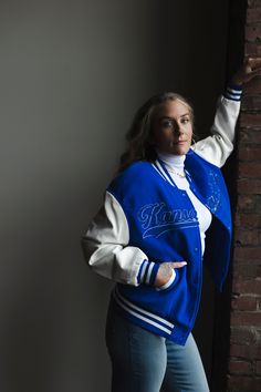 Show your city pride in style with this Kansas City letterman bomber jacket. Crafted with durable material, this jacket is built to last and proudly displays the iconic Kansas City logo. Show your love for the city today! Model is 5’7 wearing a medium unisex Royal Blue Urban Varsity Jacket For Game Day In Fall, Hooded Varsity Outerwear For Game Day, Urban Outerwear For Game Day In Fall, Urban Style Outerwear For Game Day In Fall, Hooded Varsity Jacket For Game Day In Fall, Sporty Letter Print Outerwear For Game Day, Varsity Long Sleeve Outerwear For Game Day, Varsity Jacket With Ribbed Cuffs For Game Day, Varsity Track Jacket For Game Day In Winter