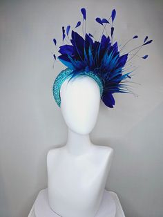 From the 2024 Featured Milliner of the Kentucky Derby Museum  Gorgeous Kentucky Derby hat fascinator  kentucky derby hat fascinator aqua blue swarovski crystal headband with navy blue spike feather and large navy royal blue feathers headband attachment each hat is totally one of a kind! no two are alike! I can probably add feathers, flowers etc to existing hats for a small fee. I cannot remove anything from existing hats. Just message me and see if we can make it work! :) I cannot make custom or Luxury Blue Feathered Headpiece, Luxury Blue Headpieces For Races, Blue Headpieces For Carnival, Blue Feather Trim Headpiece For Kentucky Derby, Blue Feather Headpiece For Kentucky Derby, Blue Feathered Headpiece For Kentucky Derby, Blue Feathered Headband Fascinator, Blue Feathered Headpiece For Party, Blue Party Hat With Feather Trim