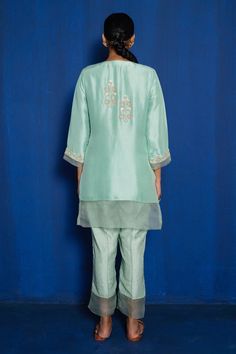 Mint green kurta with hand embroidery of zardozi with thread, cutdana and moti. Comes with pajama.
Component: 2
Pattern: Hand Embroidered
Type Of Work: Zardozi, Cutdana, Thread, Moti
Neckline: V-Neck
Sleeve Type: Three Quarter
Fabric: Silk Dupion, Organza, Noki Silk
Color: Green
Other Details: 
Sheer hem panels
Floral motifs
Occasion: Mehendi and Haldi - Aza Fashions Green Tissue Silk Sets With Floral Embroidery, Green Floral Embroidered Tissue Silk Sets, Green Floral Embroidery Tissue Silk Sets, Green Embroidered Fabric With Dori Work, Pista Green Cotton Silk Sets With Floral Embroidery, Pista Green Embroidered Fabric With Dori Work, Pista Green Straight Kurta Sets For Reception, Embroidered Pista Green Cotton Silk Palazzo Set, Art Silk Green Sharara With Floral Embroidery