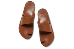 Made entirely of 100% leather – from the asymmetrical upper and toe ring, to the lining, and even the sole – each pair of FINCH leather toe-ring sandals is a testament to quality and craftsmanship. Slip them on, and within hours, they'll mold to your feet like they were tailor-made just for you. Plus, with a molded arch for comfort and support, you'll cruise all day with ease. Our commitment to sustainability is evident in our use of vegetable-tanned leathers, recycled and recyclable products, p Leather Mules With Single Toe Strap, Leather Mules With Single Toe Strap And Leather Lining, Leather Toe Post Sandals, Leather Toe Loop Sandals With Leather Footbed, Leather Mules With Heel Loop And Single Toe Strap, Summer Leather Toe Loop Mules, Summer Leather Toe Ring Sandals With Heel Loop, Leather Toe Loop Mules With Leather Sole, Leather Mules With Heel And Toe Loops