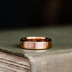 a close up of a wedding ring on top of a book