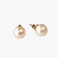 These earrings, featuring cultured saltwater Akoya pearls set in 14K yellow gold, provide a classic and timeless style that enhances any outfit. The round pearls measure 7.5-8.0mm in size, displaying a stunning luster and a bright white color that's beautifully amplified by their natural orient. Set in a versatile stud style, the earrings are suitable for both everyday wear and special occasions. With a lightweight design, they ensure comfort throughout the day. The pearls' clean surface, free f