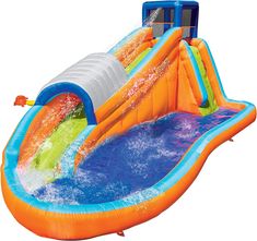 an inflatable water slide that is floating on top of blue water and orange raft