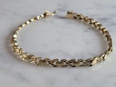 "A WOMENS VINTAGE ESTATE 14K YELLOW GOLD CHAIN BRACELET.  BRACELET IS 7\" LONG BY 3/16\" WIDE, AND WEIGHS 7.6g.  THIS WOULD MAKE A LOVELY GIFT FOR THAT SOMEONE SPECIAL. ANY QUESTIONS, PLEASE ASK.  BE SURE TO CHECK OUT SOME OF MY OTHER GREAT ITEMS UP FOR SALE. THANK YOU." Gold Oval Tennis Bracelet With Jubilee Design, Vintage Yellow Gold Tarnish-resistant Bracelet, Vintage Tarnish Resistant Yellow Gold Bracelet, Vintage Tarnish-resistant Yellow Gold Bracelet, Vintage Gold Tennis Bracelet For Anniversary, Vintage Hallmarked Yellow Gold Diamond Bracelet, Vintage Yellow Gold Diamond Bracelet, Vintage Yellow Gold Diamond Jubilee Bracelet, Vintage Gold Tennis Bracelet As Gift