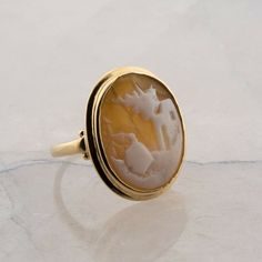 Vintage 10K Yellow Gold Shell Cameo Ring, scenic cameo, Ring size 6, 4.12 gramsStock # BB302R01Most rings are sizable for a small fee. If the ring you are considering is the incorrect size contact us for a quote.This listing contains photographs of the actual item you will receive. Our items are in excellent condition with little or no signs of wear and many are one of a kind pre-owned estate finds. Please look closely at the pictures in this listing as they are part of the product description. Classic Oval Cameo Rings, Yellow Gold Cameo Ring Fine Jewelry, Classic Cameo Yellow Gold Rings, Cameo 14k Gold Rings For Collectors, Collectible 14k Gold Cameo Rings, Formal Cameo Signet Ring, 14k Gold Cameo Ring Fine Jewelry, 14k Gold Cameo Rings For Collectors, Oval Cameo Yellow Gold Ring