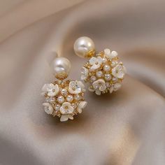 Exclusive classic style various earrings for brides.  Decorated with pearls and zircon.  Earrings decorated with flower blossoms will go well with any bridal dress.  It's a great choice to be unique.  Gives a sense of luxury. When placing an order, you must specify your phone number.  otherwise the parcel will not be sent. Pearl Flowers, Packaging Gift, Stud Earrings For Women, Wedding Jewelry Earrings, Pearl Flower, Pearl Stud Earrings, Style Classique, Pearl Studs, Elegant Earrings