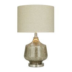 a table lamp with a white shade on it and a beige linen lampshade