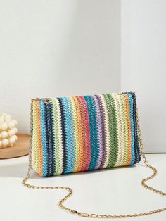 This Rainbow Dreams straw bag is perfect for your vacation getaway with its colorful striped pattern. The flap closure keeps your essentials secure while adding a touch of style. Its lightweight design makes it easy to carry around, making it the ideal travel companion. Color : Multicolor Type : Straw Bag Bag Size : Mini Strap Type : Chain Pattern Type : Colorblock Style : Vacation Composition : 100% Polyester Material : Straw Size Bag Height Bag Length Bag Width Strap Length one-size 14 20 5 120 Chain Pattern, Small Tote Bag, Leather Pattern, Decorative Accents, Small Tote, Travel Companion, Bag Bag, Bird In Bag, Square Bag