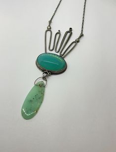 "This piece has MOXY  ....necklace style featuring this lush glow seafoam blue green vintage glass piece & epic chrsoprase dropwith eclectic metalwork detailsthis necklace will not disappoint!! made with oxidized sterling silver and vintage glass 3.25\" x 1.5\" x .25\".  this piece is handmade by me from start to finish in my studio in austin, texas. the piece is constructed of sterling silver, soldered, sanded, filed, hand set stone, oxidized, and sanded again and features a handmade clasp and is signed on the back.  due to the handmade nature of this piece there may be subtle differences between the piece pictured and the piece especially made from you.  please specify the length of chain you prefer in the notes to seller section. thanks for looking enjoy your awesome day **pieces will b Handmade Modern Green Jewelry, Modern Handmade Green Jewelry, Green Handmade Modern Jewelry, Modern Green Handmade Jewelry, Modern Green Cabochon Jewelry, Artisan Chrysoprase Necklaces For Jewelry Making, Green Cabochon Bohemian Necklaces, Green Bohemian Oval Pendant Jewelry, Unique Chrysoprase Gemstone Necklace