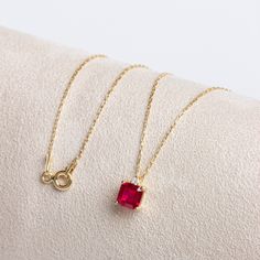 "Garnet Stone; The representative of passion, true friendship, loyalty, success and consistency.  Our single diamond squar ruby necklace is a jewel that you can use daily and on special occasions with its minimalist design. It is a nice gift for yourself and your loved ones. Our necklace will add novelty and elegance to your style. The birthstone of those born in January is garnet. You are welcome to our store for all our products; https://www.etsy.com/shop/StyleDiamond?ref=seller-platform-mcnav Ruby Locket, Gold Chain For Women, Chirstmas Gift, Solid Gold Necklace, Chain For Women, Ruby Necklace, Birthstone Pendant, True Friendship, Ruby Stone