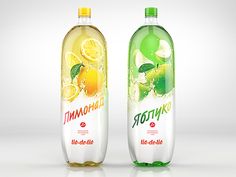 two bottles of soda with lemon and lime on them