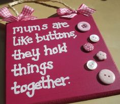 a sign that says mums are like buttons, they hold things together on it