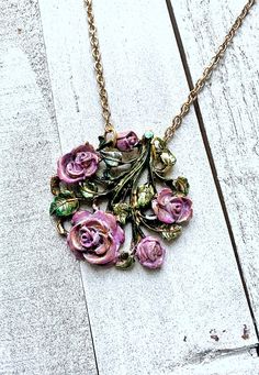 This is a beautiful long necklace made from a brooch. I have hand painted the leaves and roses to give it a little more pop!!  Love the 3D detail of roses, leaves, and vines. It is vintage, yet trendy for today. The chain is 30 inches long. Vintage Assemblage Jewelry, Des Roses, Assemblage Jewelry, Pendant Watches, Swarovski Necklace, Rose Necklace, Vintage Brooch, Gift For Wife, Round Pendant