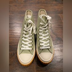 Nib J.Crew Classic Canvas High Top Sneakers Size- 7 Color- Pistachio Ivory. Say Hello To Our Newest Sneakera Classic Canvas High-Top. With A Durable, Vulcanized Rubber Sole And Cushy Footbed, They're Comfy Enough To Wear Everydayfrom Coffee Runs To Dog Walks And Everything In Between. Feel-Good Fact: This Canvas Is Made From 65 Percent Recycled Materials. Cotton Upper And Lining. Rubber Sole. Sold Out Online! The Perfect Statement Sneaker! Khaki Sneakers With Vulcanized Sole And Round Toe, Khaki Sneakers With Vulcanized Sole, Casual Khaki Lace-up High-top Sneakers, Green Canvas Shoes With Round Toe And Laces, Green Canvas Shoes With Laces And Round Toe, Casual Khaki Sneakers With Vulcanized Sole, Khaki Lace-up Sneakers For Spring, Green High-top Canvas Shoes With Contrast Sole, Green Canvas Shoes With Contrast Sole