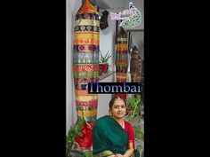 a woman sitting on a chair in front of vases and other decorative items with the words ihomba above her