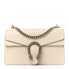 This is an authentic GUCCI Textured Calfskin Crystal Small Dionysus Shoulder Bag in Mystic White. This stylish bag is crafted oftextured calfskin leather in white. This shoulder bag features an aged silver chain shoulder strap, and a textured horseshoe closure with lion heads at the end. This opens to a beige fabricinterior with a central zipper pocket. Gucci Soft Leather Shoulder Bag, Gucci Soft Leather Bag For Formal Occasions, Gucci Soft Leather Rectangular Shoulder Bag, Gucci Leather Clutch Shoulder Bag, Gucci Soft Leather Crossbody Bag, Gucci Soft Leather Top Handle Shoulder Bag, Elegant Gucci Soft Leather Bags, Gucci Luxury Soft Leather Shoulder Bag, Luxury Gucci Shoulder Bag In Soft Leather