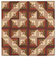 a large quilt with many different colors and shapes on the front, along with an intricate design