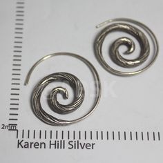 KAREN HILL Tribe 98% Handmade SILVER 22mm Spiral Twist Pattern Earring KN36 Thai Karen Hill Tribe Silver is Handcrafted by Professional Tribe Artisan. Please refer to the Description for actual size shown below. Measurment is only approximately SIZE :22mm Guarantee THAI KAREN HILL TRIBE products that consists of 98-99% REAL SILVER ( more then 925 Sterling ) , FIRST GRADE WE SUPPORTS KAREN ARTISANS THROUGH FAIR TRADE WEIGHT 6.6Grams (pair) Note: Karen Hill Tribe Silver are all handmade so not one Silver Spiral Hoop Earrings In Metal, Handmade Spiral Metal Hoop Earrings, Unique Spiral Metal Hoop Earrings, Adjustable Spiral Metal Hoop Earrings, Unique Spiral Nickel-free Hoop Earrings, Unique Nickel-free Spiral Hoop Earrings, Handmade Spiral Silver Hoop Earrings, Silver Spiral Handmade Hoop Earrings, Spiral Silver Hoop Earrings As Gift