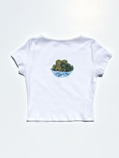 The best selling Olive Bowl graphic now available in the Alex Tee!! Details Classic white cropped baby t-shirt in a lightweight cotton jersey100% Deadstock cottonMachine wash cold, gentle, lay flat to dry only. Do not bleach. Made in Los Angeles Size Bust Total Length Sleeve Length XS 30-35" 17.5" 5.25" S 32-37" 18" 5.5" M 34-39" 18.5" 5.75" L 36-41" 19" 6" XL 39-44" 19.5" 6.25" 2XL 42-47" 20" 6.5" 3XL 45-50" 20.5" 6.75" Olive Bowl, Fun Fruit, Grafic Tees, Outfit Comfortable, Y2k Crop Top, Y2k Tops, Cropped Long Sleeve Top, Y2k Shorts, Y2k Preppy