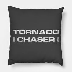 a black pillow with the words tornado chaser printed in white on it's front