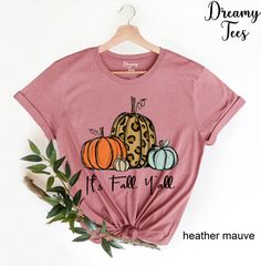 "It's Fall Y'all Shirt, Fall Shirt, Pumpkin Shirt , Cute Fall Tshirt, Fall Mom Shirt, Fall Teacher Shirt, Women's Fall Shirt, Gift For Her --- SIZING AND COLOR --- Listing photos contain colors and measurements for both women's v-neck and unisex crew neck shirts. Please be careful of which style you select from the drop down menu and double-check your measurements to make sure you order the proper size all since we do not offer returns/exchanges. We make each shirt to order and all sales are fin Pink T-shirt With Funny Print For Fall, Pink Relaxed Fit T-shirt For Fall, Fall Funny Print Short Sleeve Tops, Funny Print Short Sleeve Tops For Fall, Pink Letter Print Shirt For Fall, Pink T-shirt For Fall, Pink Graphic Print Shirt For Fall, Pink Funny Print T-shirt For Fall, Pink Cotton T-shirt For Fall